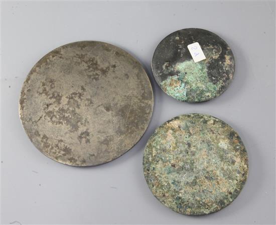 Three Chinese bronze mirrors, Tang dynasty or later, diameter 8.2cm - 13cm